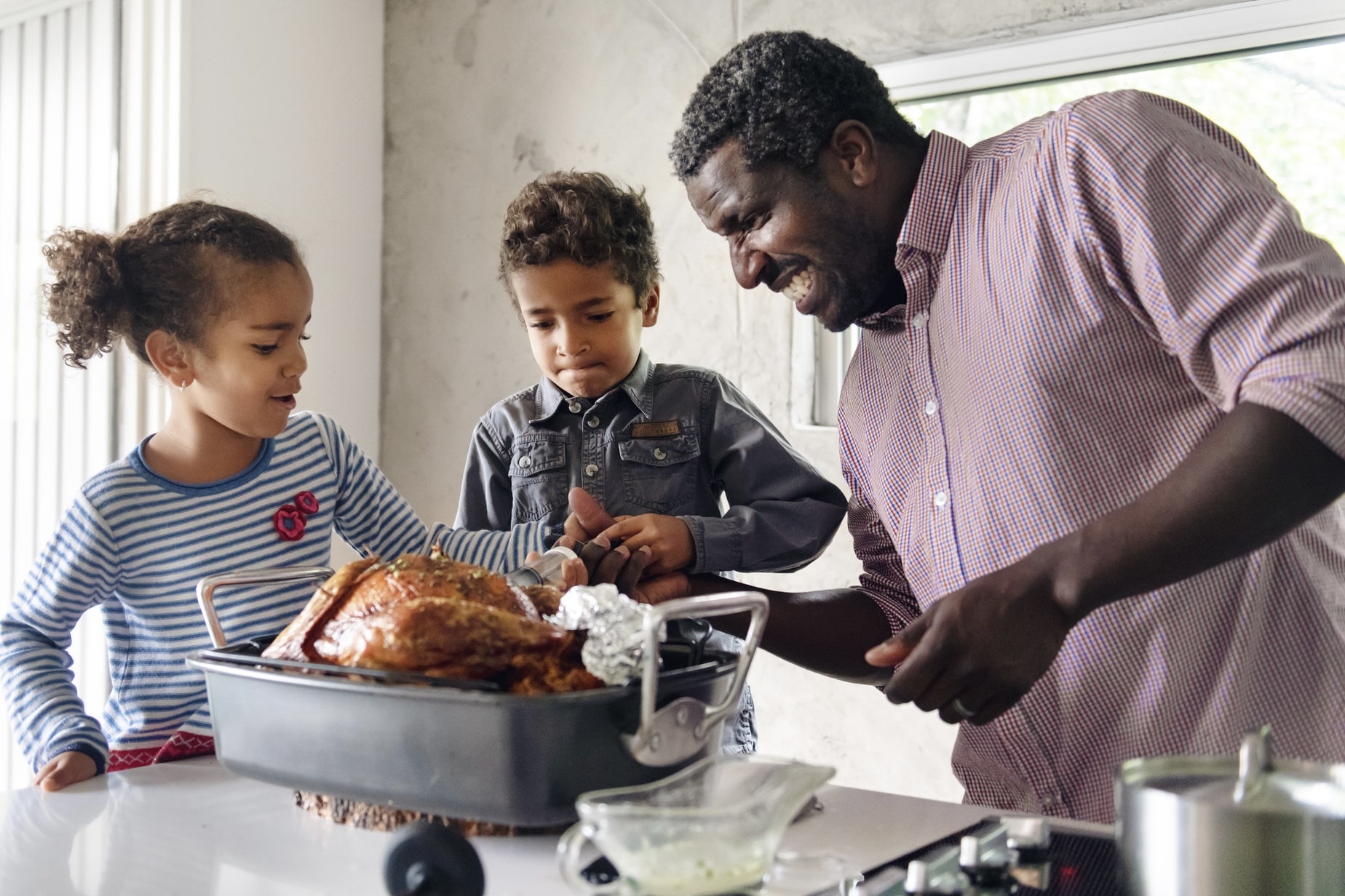 family of three getting ready for Thanksgiving