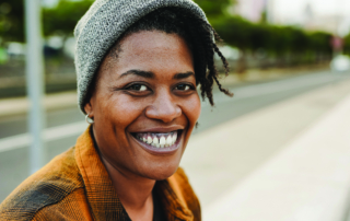 Young African American individual smiling