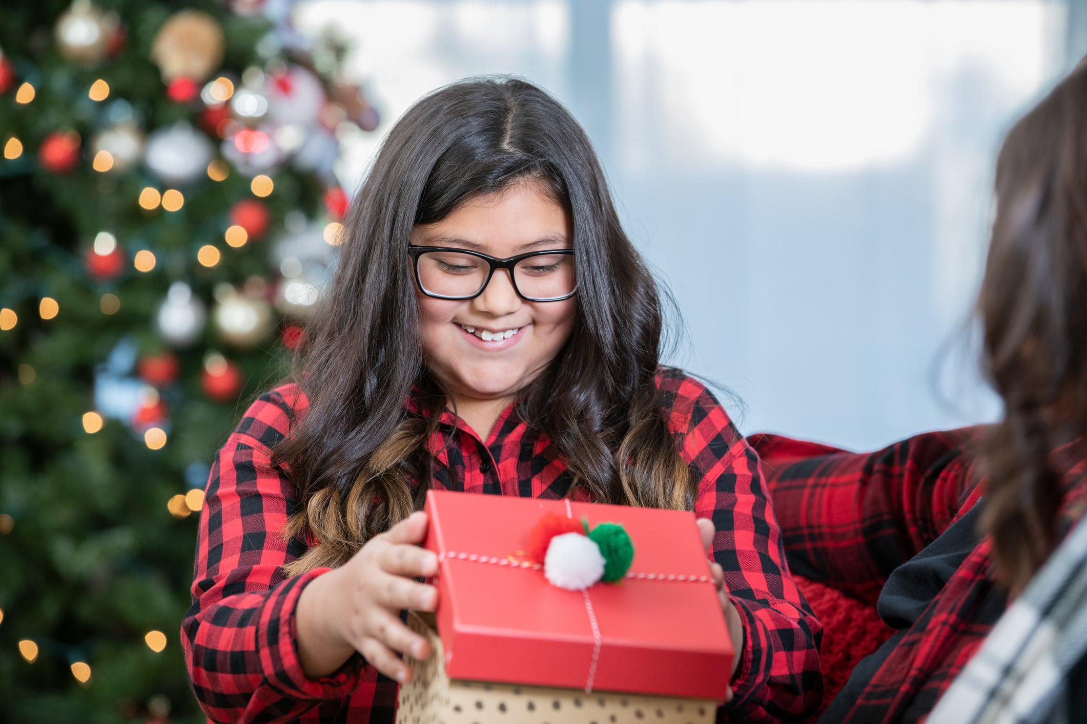 teen holding holiday present