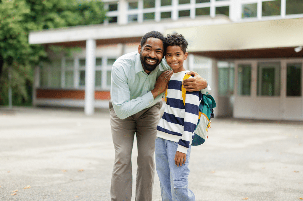 Father dropping son off at school